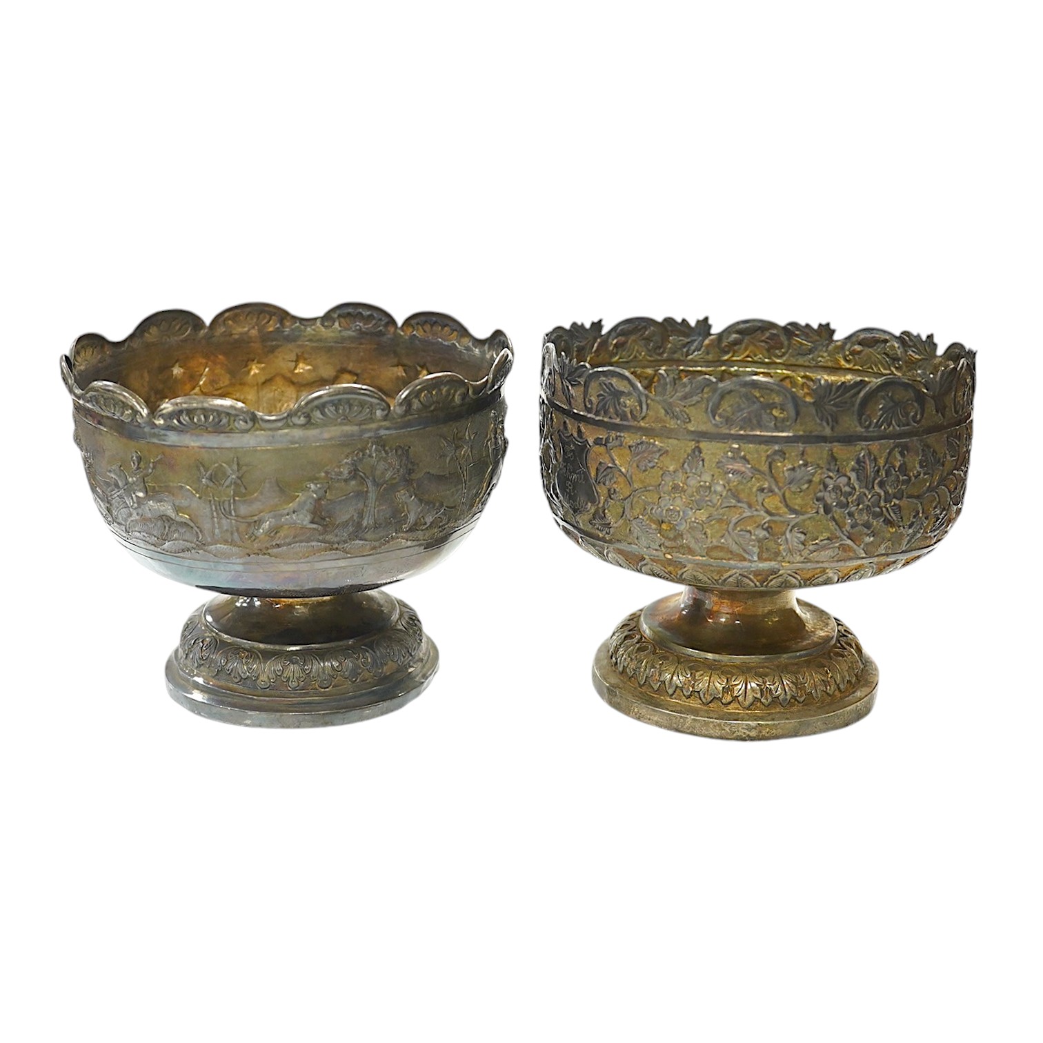 Two early to mid 20th century Indian white metal pedestal bowls, including one embossed with continuous hunting scene, diameters 14.2mm and 13.8mm, 18.1oz. Condition - poor